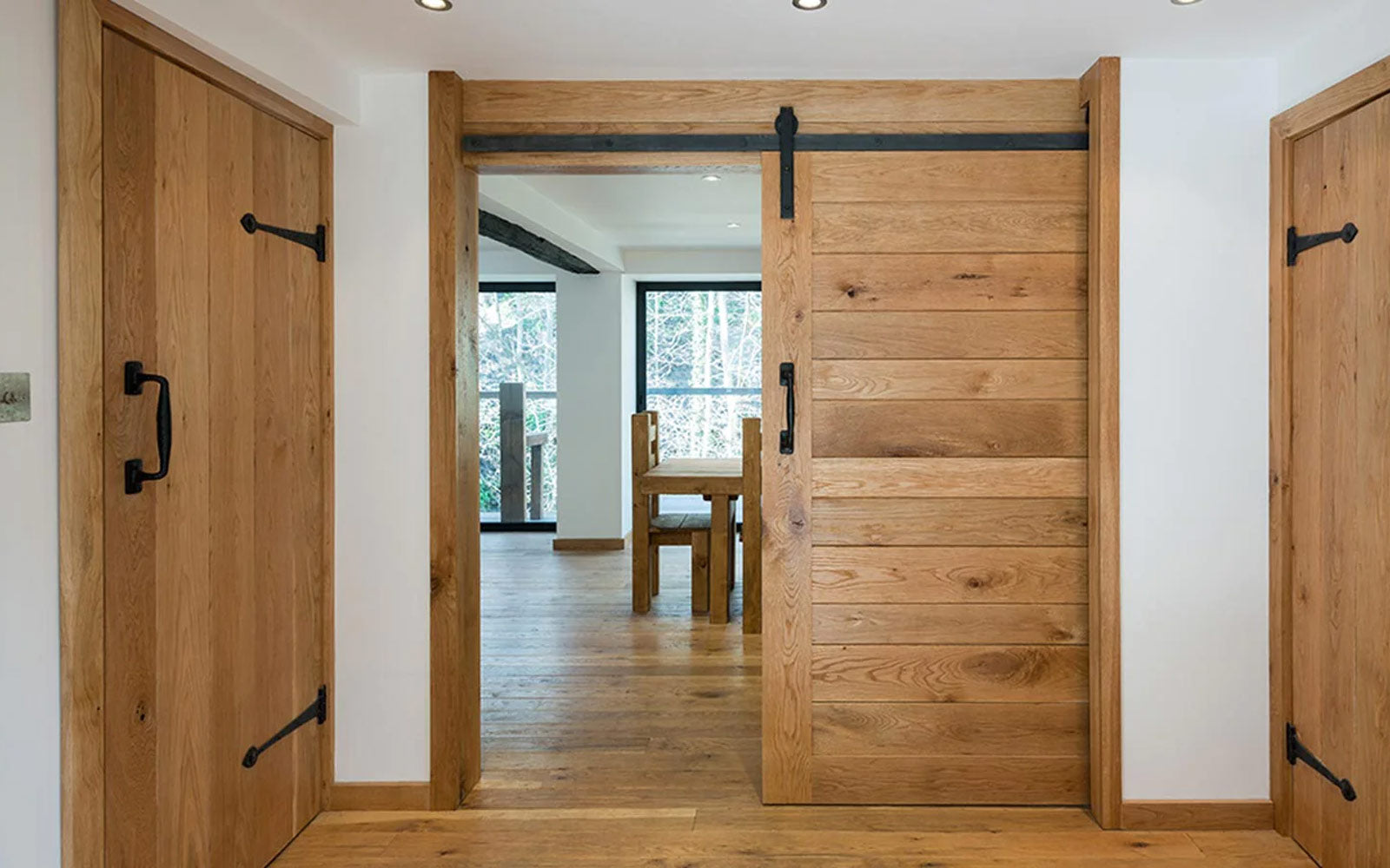 rustic pocket door with black barn door hardware